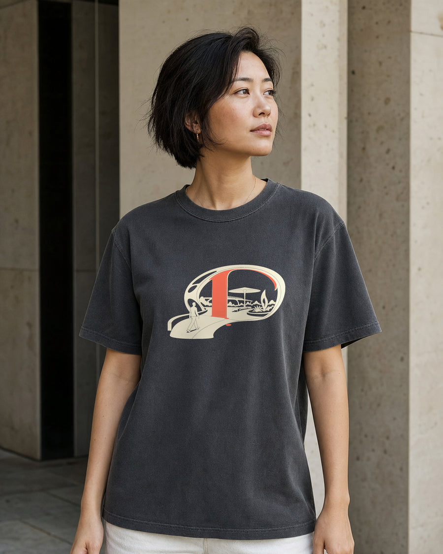 Model wearing the Utopia Pending Tee in Shadow, front view