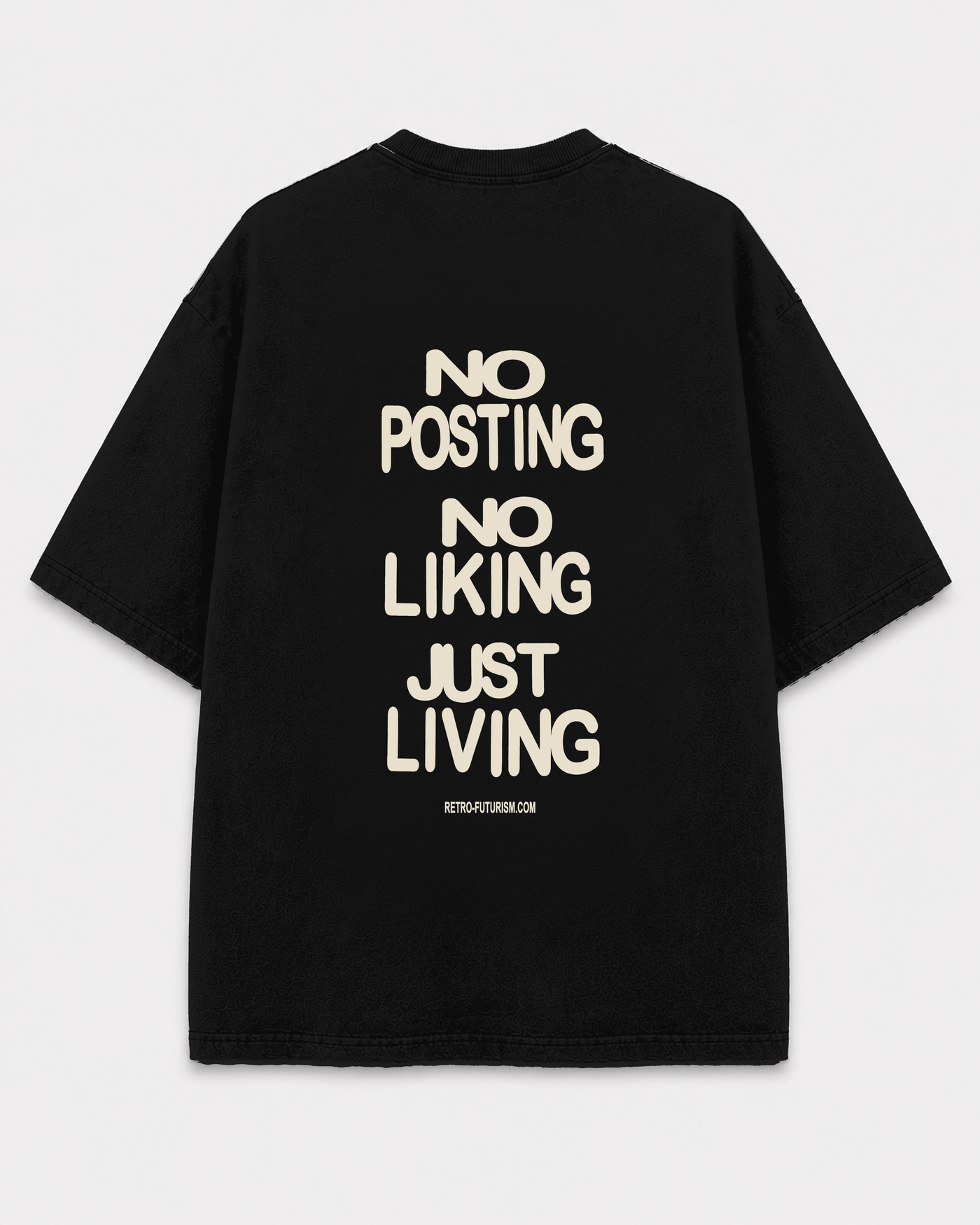 Back view of the black Just Living Tee with the bone-colored phrases NO POSTING, NO LIKING, and JUST LIVING, plus a small RETRO-FUTURISM.COM footer.