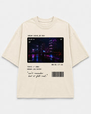 Dream Cache Tee front graphic with timestamp dream-file and neon city details